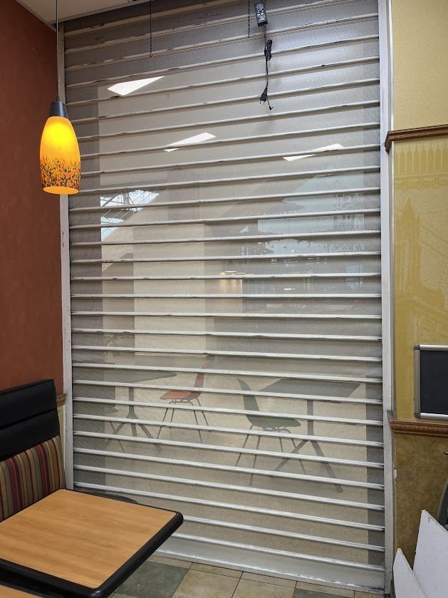 Micro-perforated slat shutter installed for a restaurant – repair in Lassy
