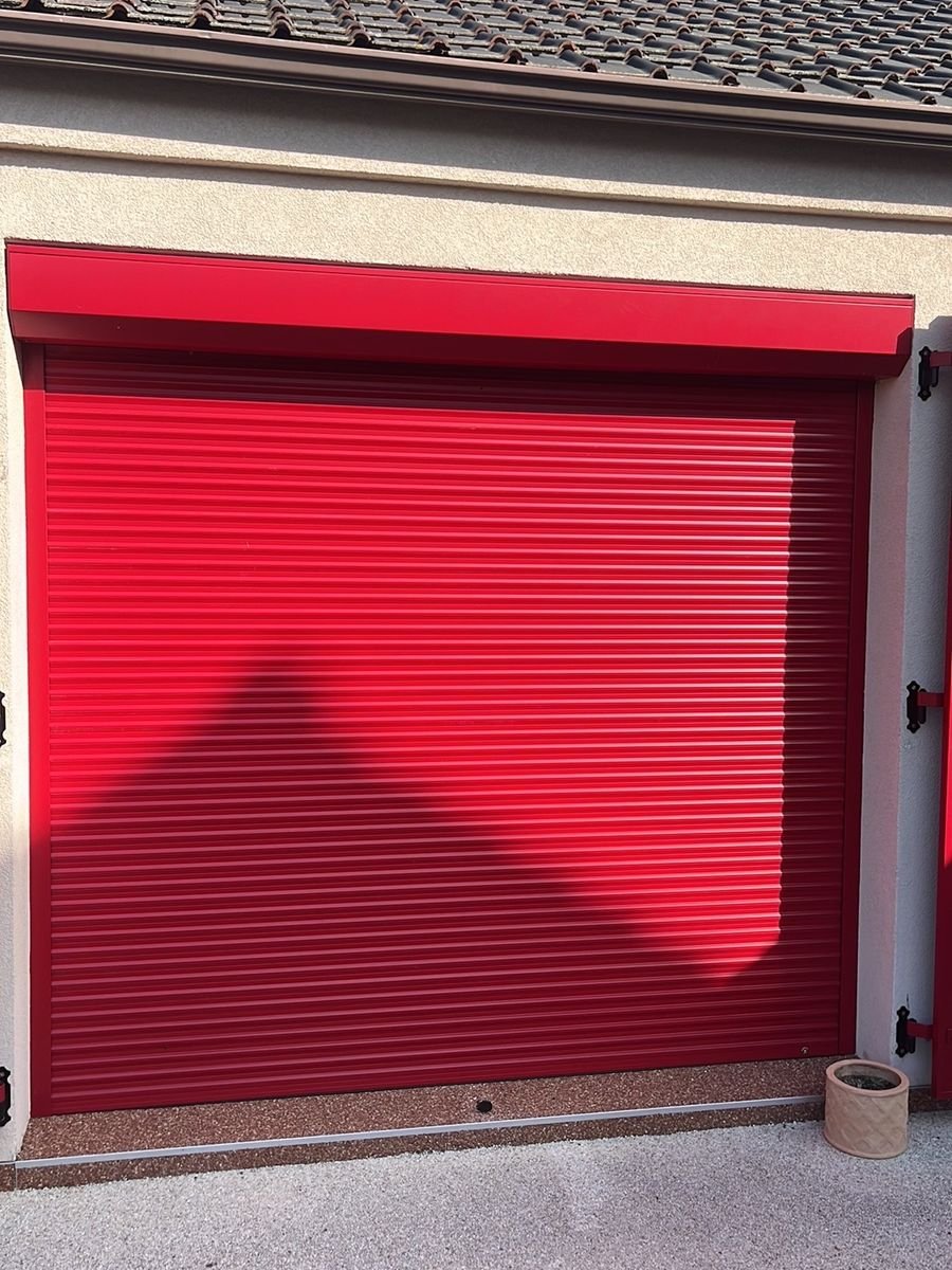 Red roll-up garage door with matching box and guides – roller shutter repair in Maisons-Laffitte