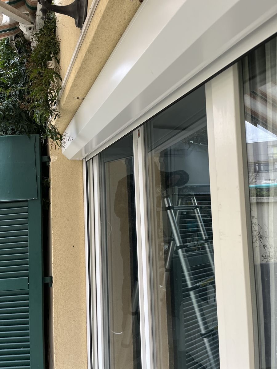 DRM Paris technician fitting a renovation roller shutter box – roller shutter repair in Fleury-en-Bière